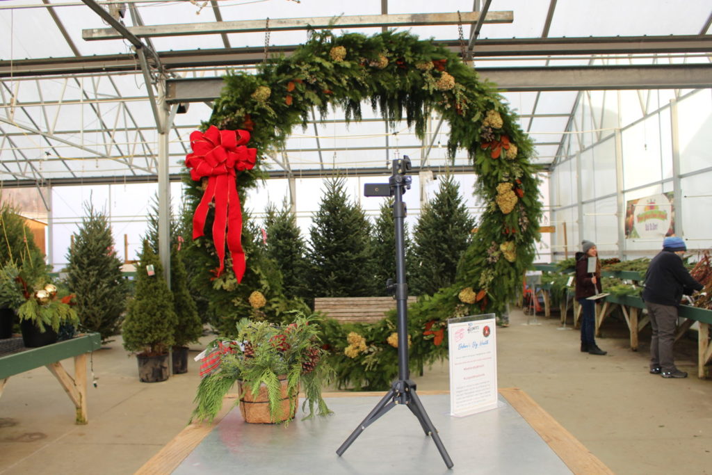 Selfie Spot. What do you do when you see the largest handmade live evergreen wreath in western Pennsylvania? Take a selfie! Customers can use the handy tripod stand set up to DIY their holiday photos.
