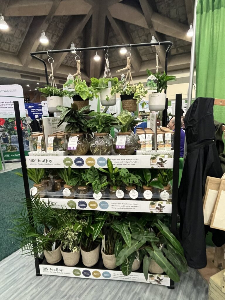 The Plant Co.’s booth was stocked with houseplants — over 100 varieties are now available from the company, said Ben Wright, national account manager. Retail-ready hanging baskets, beakers and bowls are among the top sellers, as well as the leafjoy H2O Minis contained in glass jars.