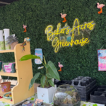 The cash wrap at Baker’s Acres Greenhouse includes grab-and-go items like stickers featuring Thelma, one of the on-site cats.