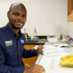 Geoffrey Meru, an associate professor of vegetable breeding, genetics and genomics at the UF/IFAS Tropical Research and Education Center, studies vegetables and squash in his lab. Photo courtesy of Tyler Jones, UF/IFAS photography.